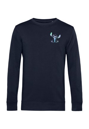 Maglietta a maniche lunghe blu navy con scollo rotondo, con un piccolo personaggio dei cartoni animati colorato sul petto in alto a sinistra.