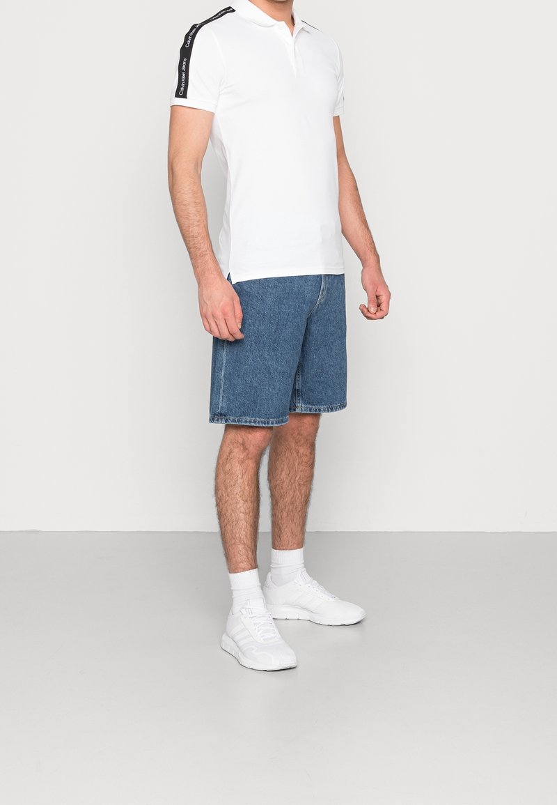 Calvin Klein Jeans Shorts di jeans light-blue denim/carta da