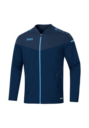 Blaues Sportjackett mit Reißverschluss vorne, dunkelblauem oberen Bereich, hellblauen Akzenten und seitlichen Reißverschlusstaschen. Mit Punkten gemusterte Detail an den Schultern.
