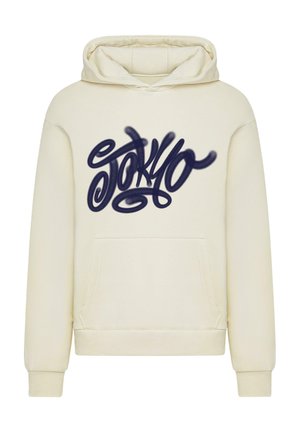 Kreemivärvi kapuutsiga sviiter, mis on valmistatud pehmest kangast. Keseosas on suur tumehall "TOKYO" graafika stiliseeritud kirjas. Ees on praktiline tasku.