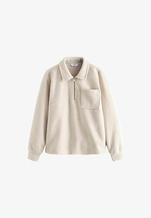 Fleece pullover in light beige with a zippered collar, a chest pocket, and ribbed cuffs. Soft texture with a relaxed silhouette.
