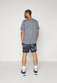 Under Armour VANISH PRNT  - Sports shorts - black/castlerock