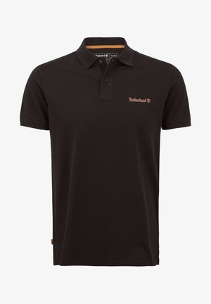 Polo noir en tissu uni, avec col, manches courtes et un petit logo Timberland marron sur la poitrine.