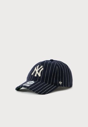 Navy blue baseball cap with white pinstripes, embroidered logo on the front, curved brim, and a small logo on the side.