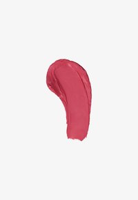 Jevn, buet strimmel av kremet rosa leppestift smurt på en hvit bakgrunn, som viser tekstur og farge.