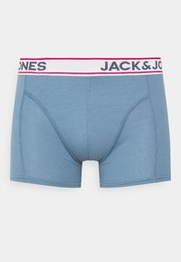 Blue cotton boxer shorts with a white waistband featuring "JACK & JONES" in black lettering and red accents. Smooth texture, fitted design.