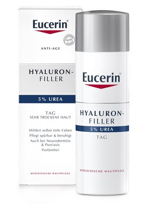 Eucerin Hyaluron-Filler Anti-Aging-Creme in einer weißen zylindrischen Flasche mit silberner Kappe; die Verpackung weist blaue und rote Akzente auf; 5% Harnstoff.