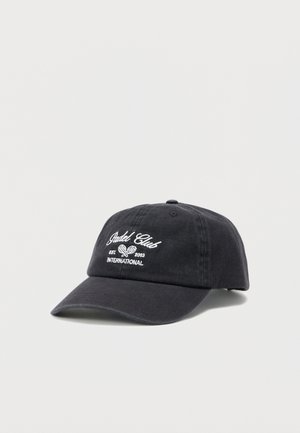 Casquette de baseball noire avec texte brodé blanc « Padel Club EST 2003 INTERNATIONAL » et logo de raquettes de padel croisées à l'avant.