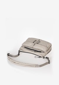 Light gray padded crossbody bag with multiple zippered pockets and adjustable strap on a white background.