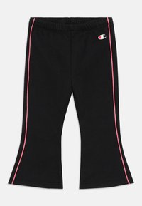 Fekete harang szárú leggings, elasztikus derékkal, rózsaszín oldalsávokkal és egy kicsi logóval elöl. Puha, rugalmas anyagból készült.