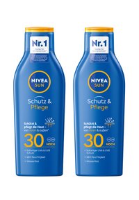 Two blue NIVEA Sun sunscreen bottles, with yellow lids, labeled SPF 30. Text highlights UVA/UVB protection and moisturizing features.