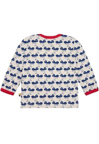 Langarmshirt van lichte stof, met een crèmekleurige achtergrond en marineblauwe mierenpatronen, en een rode geribbelde halslijn.