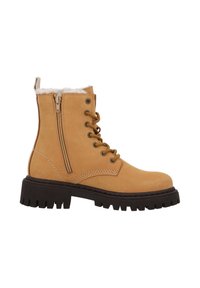 Tan enkelboot met dikke zwarte lugzool, voorzijde met veters, zijrits en witte fleece voering zichtbaar aan de bovenkant.