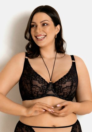 - Biustonosz z trójkątną miseczką