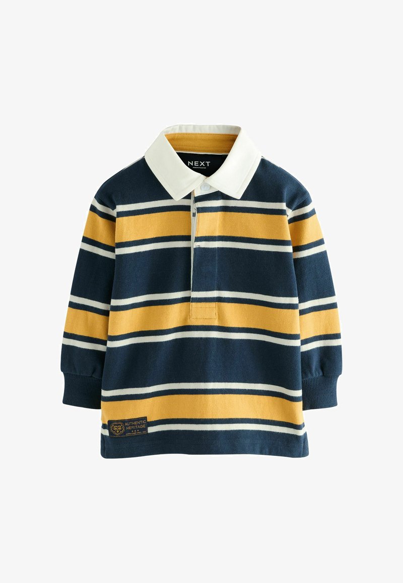 Tengerészkék és sárga csíkos, hosszú ujjú pólóing, fehér gallérral és hímzett logóval az alsó bal oldalon. Gombos nyakkivágással rendelkezik.