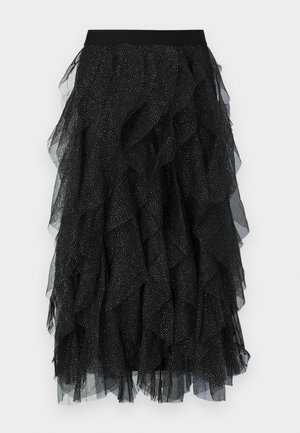 Sort tylskørt med lagdelte flæser, en bred elastisk taljebånd og spredte sølvprikker over stoffet.