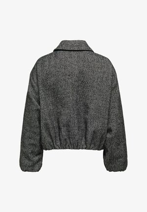Veste cropped en chevrons noir et gris avec un large col, une taille élastique et des manches longues bouffantes. Tissu texturé avec une finition lisse.