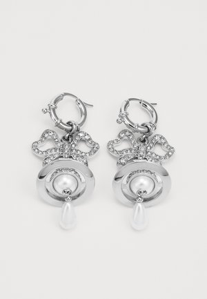 Silver hoop earrings featuring a bow design adorned with clear rhinestones, a pearl centerpiece, and a pear-shaped drop accent.
