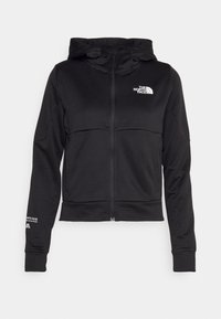 Felpa con zip nera e texture a coste, cappuccio regolabile, logo bianco sul petto e decorazione ricamata sul maniche. Presenta maniche lunghe e tasche.