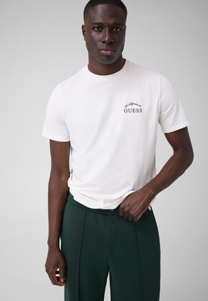 Guess, T-SHIRT MIT GESTICKTEM LOGO - T-shirt imprimé - weiß