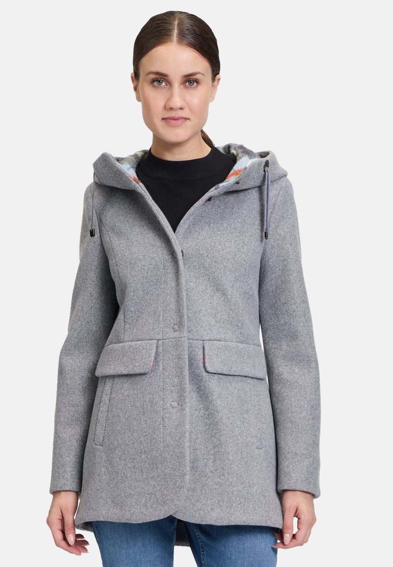 Grauer Wollmantel mit Kapuze, vorderen Taschen und Knopfverschluss. Innen ist er mit einem bunten Karo-Futter ausgestattet. Glatte Textur.