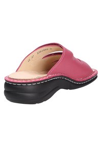 Pink leather slide sandal with a rounded toe, open back, and white stitching detail. Textured black rubber sole for grip and comfort.