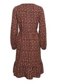 Vestido de manga larga con un patrón geométrico en óxido, crema y negro. Cintura elástica y dobladillo acampanado para un ajuste relajado.