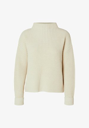 Pull en laine épaisse crème avec un col montant, des épaules tombantes et des poignets côtelés. Le tissu texturé offre une apparence douce et confortable.