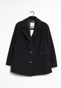 Svart ullrock med kavajkrage, fyra knappar, två sidofickor och lätt utsvängd passform. Har en slät yta och sydda detaljer.