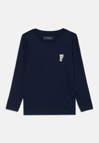 Marineblå langermet skjorte laget av bomull med rund hals og en liten hvit "F"-logo på venstre bryst. Glatt tekstur, uformelt design.