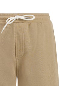 Beige casual broek met een elastische tailleband en een witte, gebonden aantrekkoord, voorzien van zichtbare stiksels en een zijzak.
