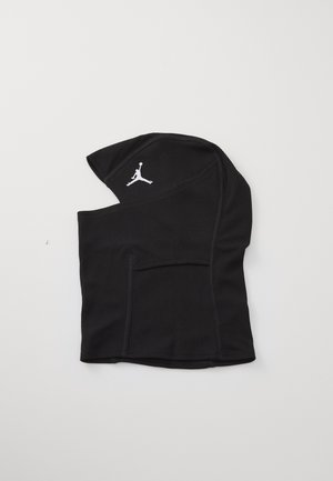 Black hooded garment made of ribbed fabric, featuring a side pocket and a white Jumpman logo on one side. Simple, functional design.