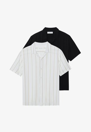 Short-sleeve button-up shirts in white with beige stripes and solid black. Both have classic collar and smooth fabric texture.