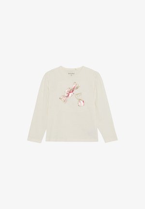Langärmliges cremefarbenes Hemd mit einem mit Pailletten verzierten Bonbonmotiv in Rosa und Gold. Weiches Strickmaterial mit einem runden Ausschnitt und angesammelten Schultern.