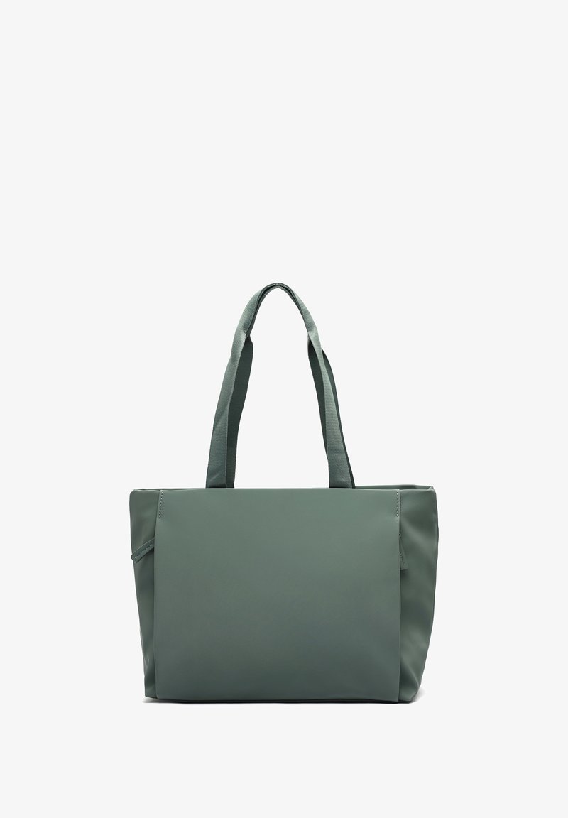 Grön tote bag med dubbla handtag, tillverkad av ett slätt, hållbart material. Har en enkel rektangulär form och en minimalistisk design.