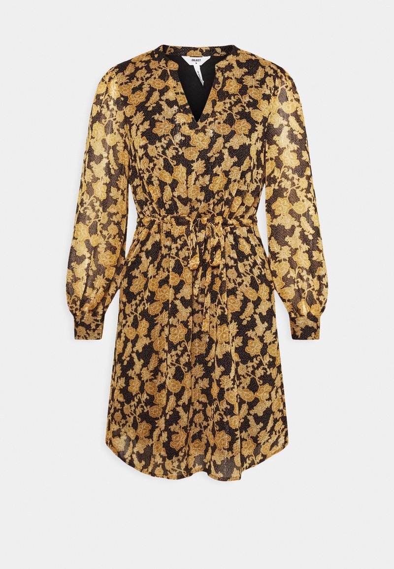 Robe noire avec un motif floral doré, encolure en V, manches longues bouffantes et détail de taille nouée. Tissu transparent avec une texture douce.