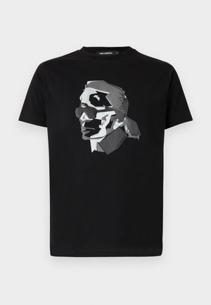 Black cotton t-shirt featuring a geometric, monochromatic graphic design of a profile with sunglasses on the front. Classic crew neck style.
