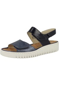 Laivastonsininen nahkasandaali, jossa on säädettävä hihna, avoin varvas ja teksturoitu valkoinen pohja. Ominaisuuksiin kuuluu tyylikäs muotoilu ja pehmustettu korkkipohja.