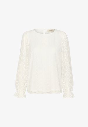 Bijela bluzica s dugim, bujnim rukavima, okruglim izrezom i teksturiranim dijamantnim uzorcima. Sadrži otvor na leđima u obliku ključa i volanaste manžete.