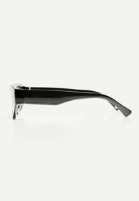 Black plastic sunglasses with a sleek, angular design; wide frame front and gently curved temples. No visible patterns or accents.