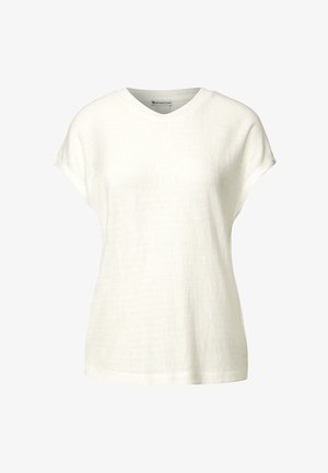 Blusa blanca de manga corta con escote en V, que presenta un patrón texturizado y un ajuste relajado. Confeccionada en una tela ligera.