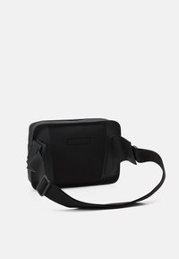 Lacoste NAOS UNISEX - Jostas soma - noir