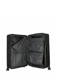 Valigia rigida nera con apertura a zip, dotata di numerose tasche e scomparti foderati in tessuto grigio. Quattro ruote per la mobilità.