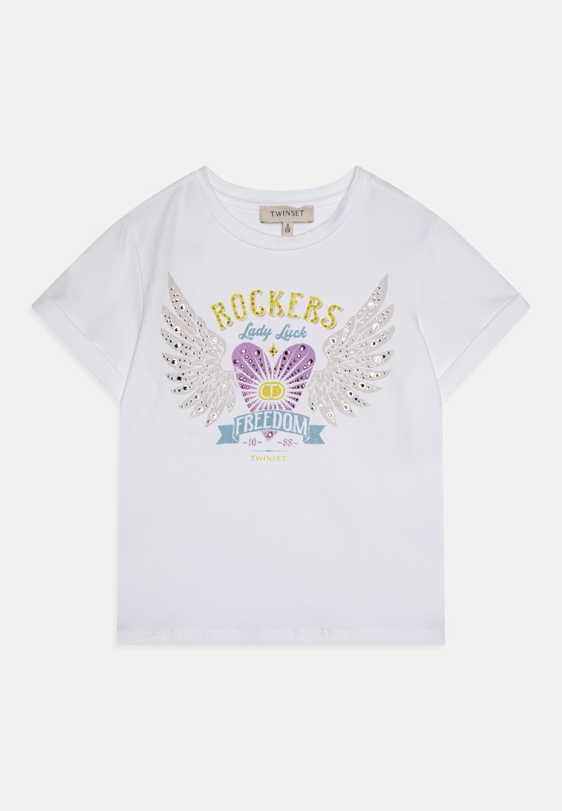 Hvid bomulds T-shirt med et grafisk design, der har pailletvinger og et hjerte, med teksten "ROCKERS Lady Luck FREEDOM" i gul og lilla.