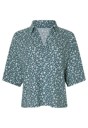 Short-sleeve shirt in dark green fabric with white floral pattern, featuring a collar and a relaxed fit design.