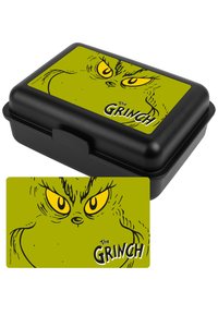 Pranzo in una scatola nera con un coperchio verde brillante che presenta un'illustrazione del volto del Grinch con occhi gialli. Il testo recita "Il Grinch."