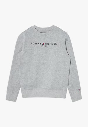 Sweat-shirt Tommy Hilfiger gris clair avec col rond, manches longues, logo et texte "EST. 1985" centré sur la poitrine, petit logo sur le poignet gauche.