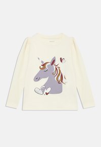 Camicia crema a maniche lunghe con grafica di un unicorno grigio con criniera colorata e cuori, realizzata in morbido cotone. Dettagliata con accenti glitterati.