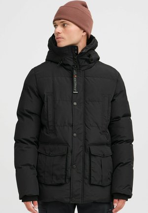 Black padded jacket with a high collar, front pockets, and a zipper closure. Features a hood and a textured finish.