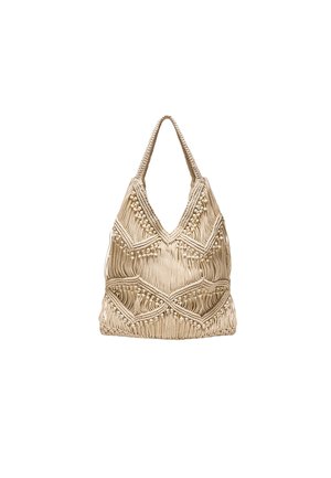 Sac à épaule macramé beige avec motifs en losange et franges, doté d'une anse tressée et de nœuds décoratifs texturés.